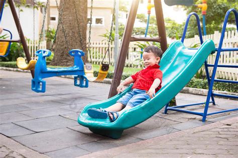 Toddler sliding on a playground